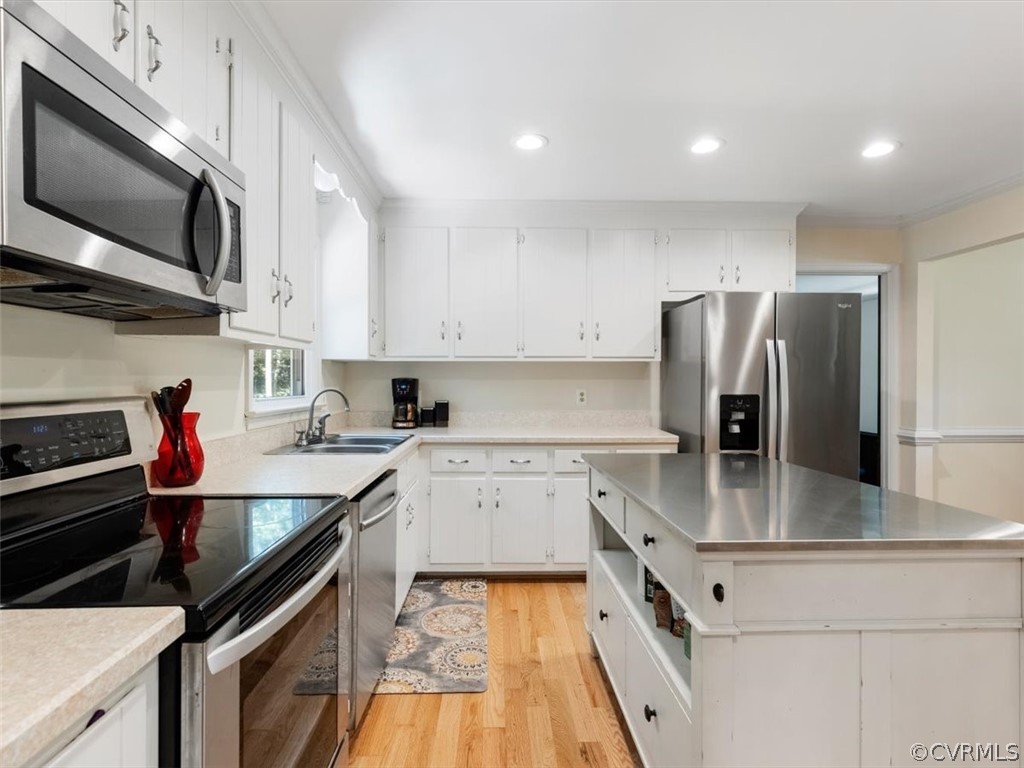 480 Eastman Road Chesterfield, VA 23236 - Photo 11 of 35 Kitchen features a large center island w/ bar stoo