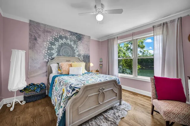 a bedroom with a bed and a couch