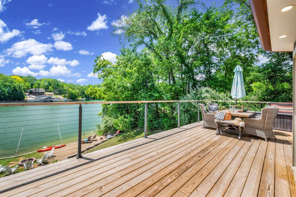 6 Barbados Court Putnam, IL 61560 - Photo 26 of 45 a view of a balcony with wooden floor and lake view