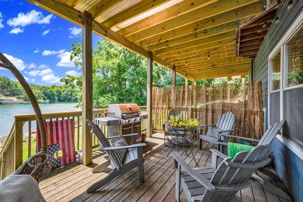 a view of balcony with couch and chairs