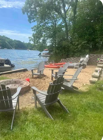 a view of a backyard with sitting area
