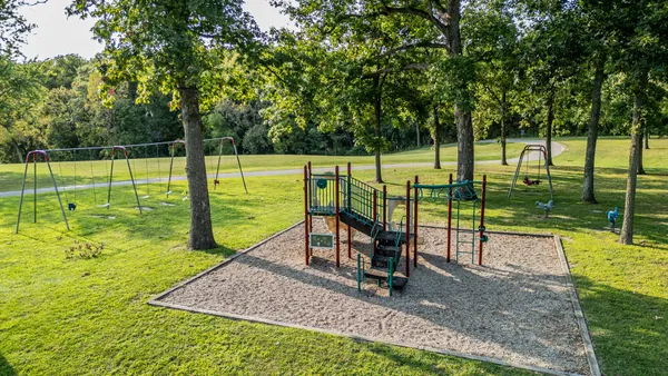 a view of a park with swings