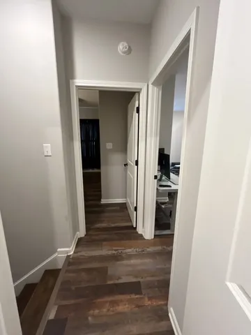 a living room with furniture gym equipment and a flat screen tv