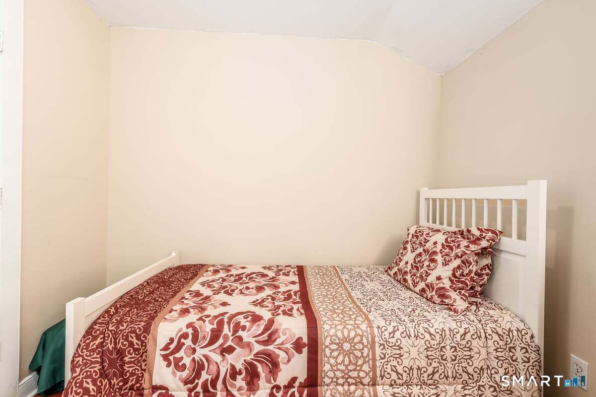70 Dodgingtown Road Bethel, CT 06801 - Photo 12 of 27 a bedroom with a bed and a window