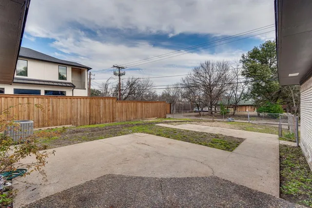 a view of backyard with tree