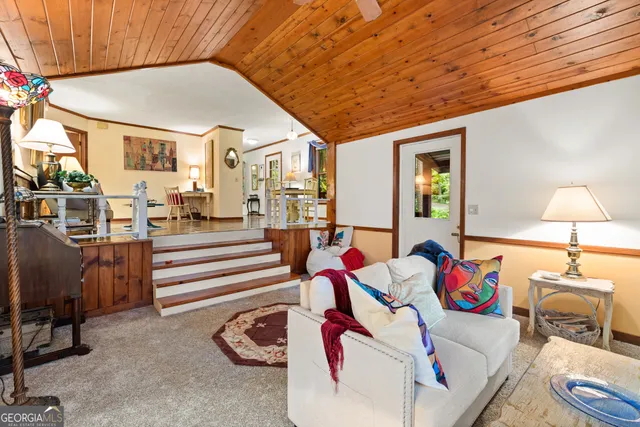 a living room with furniture and a table