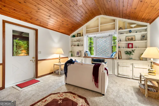 a very nice looking bedroom with a large window