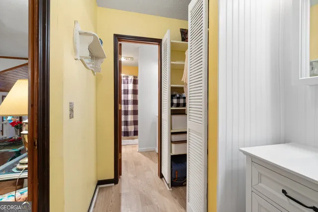 a bathroom with a shower and a sink