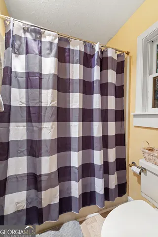 a bathroom with a checkered floor and a sink