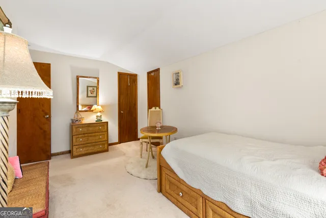 a bedroom with a bed and furniture