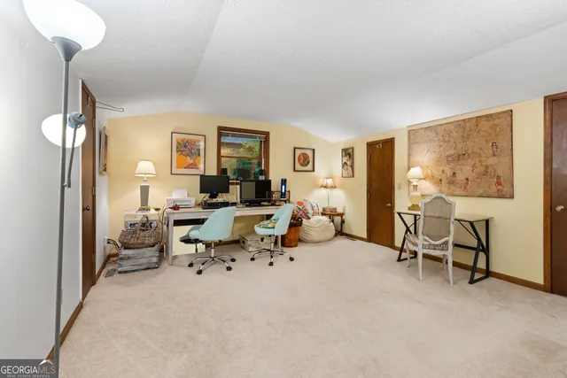 a view of a livingroom with furniture and tv
