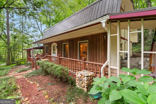 a view of a swimming pool with a yard