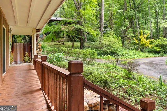 a view of balcony with wooden floor
