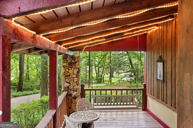a view of porch with a swing
