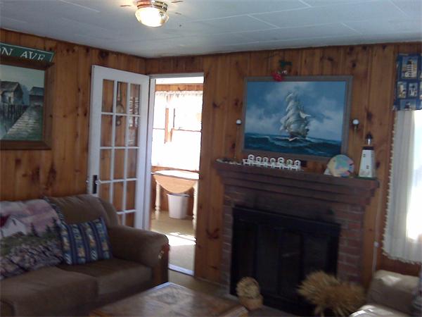 36 Edwards Road Dennis, MA 02639 - Photo 4 of 8 a living room with furniture and a fireplace