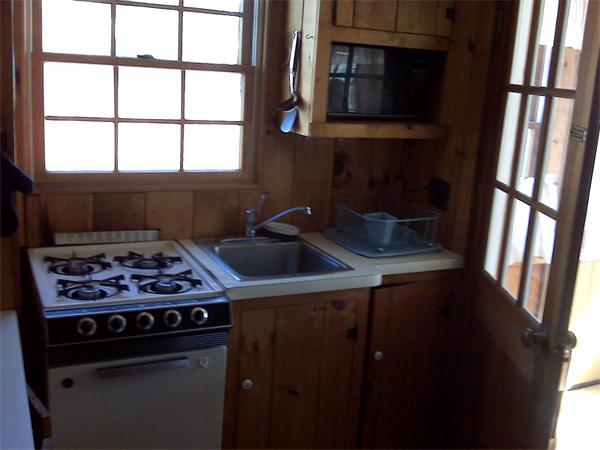 36 Edwards Road Dennis, MA 02639 - Photo 7 of 8 a kitchen with a stove a sink and a window
