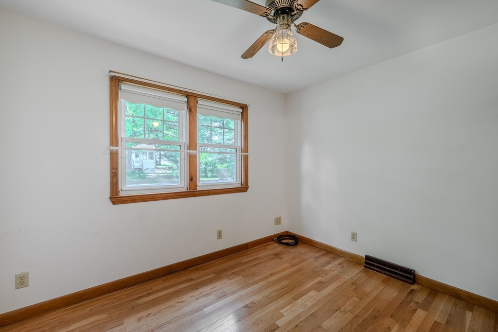 10 Primrose Road Billerica, MA 01821 - Photo 13 of 37 an empty room with a window and ceiling fan