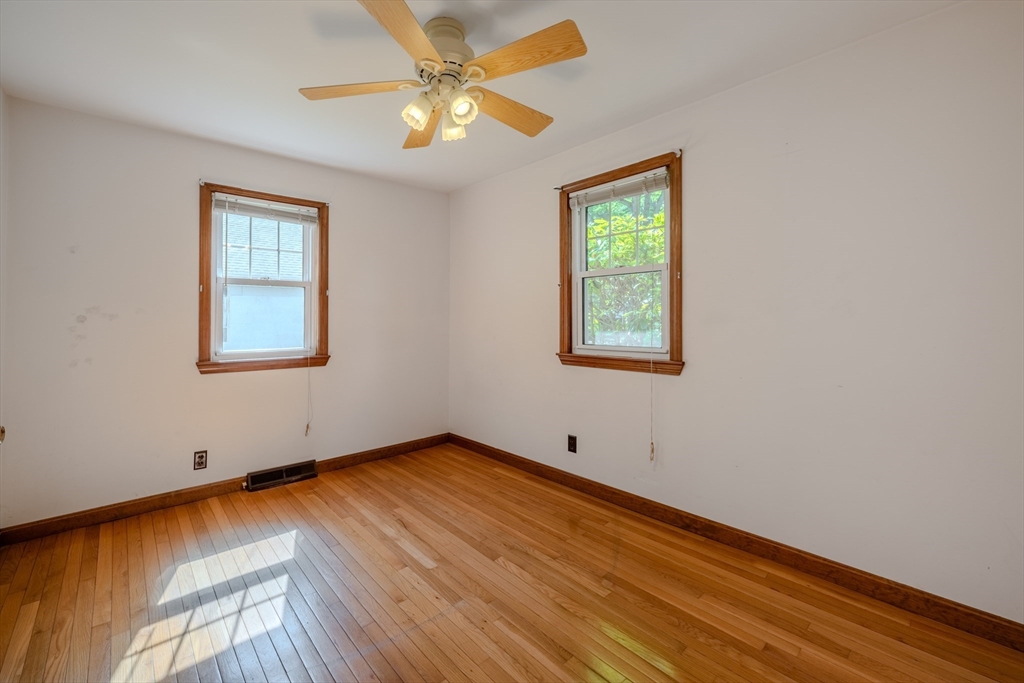 10 Primrose Road Billerica, MA 01821 - Photo 16 of 37 a view of an empty room with window and wooden floor