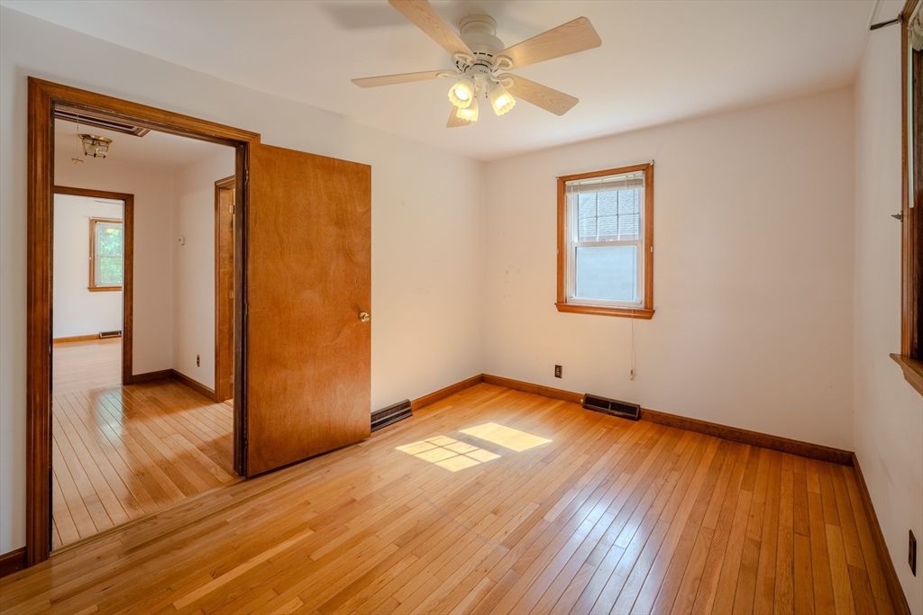 10 Primrose Road Billerica, MA 01821 - Photo 17 of 37 wooden floor in an empty room with a window