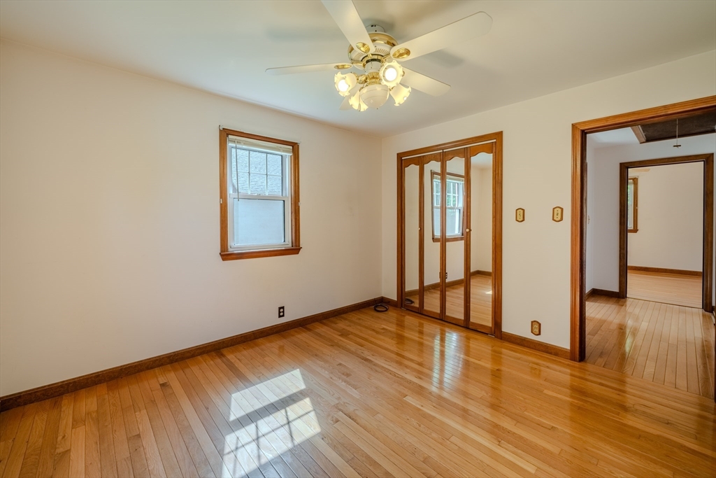 10 Primrose Road Billerica, MA 01821 - Photo 18 of 37 an empty room with wooden floor and windows