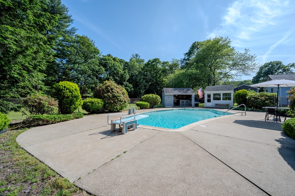 10 Primrose Road Billerica, MA 01821 - Photo 28 of 37 a view of a house with backyard and a garden