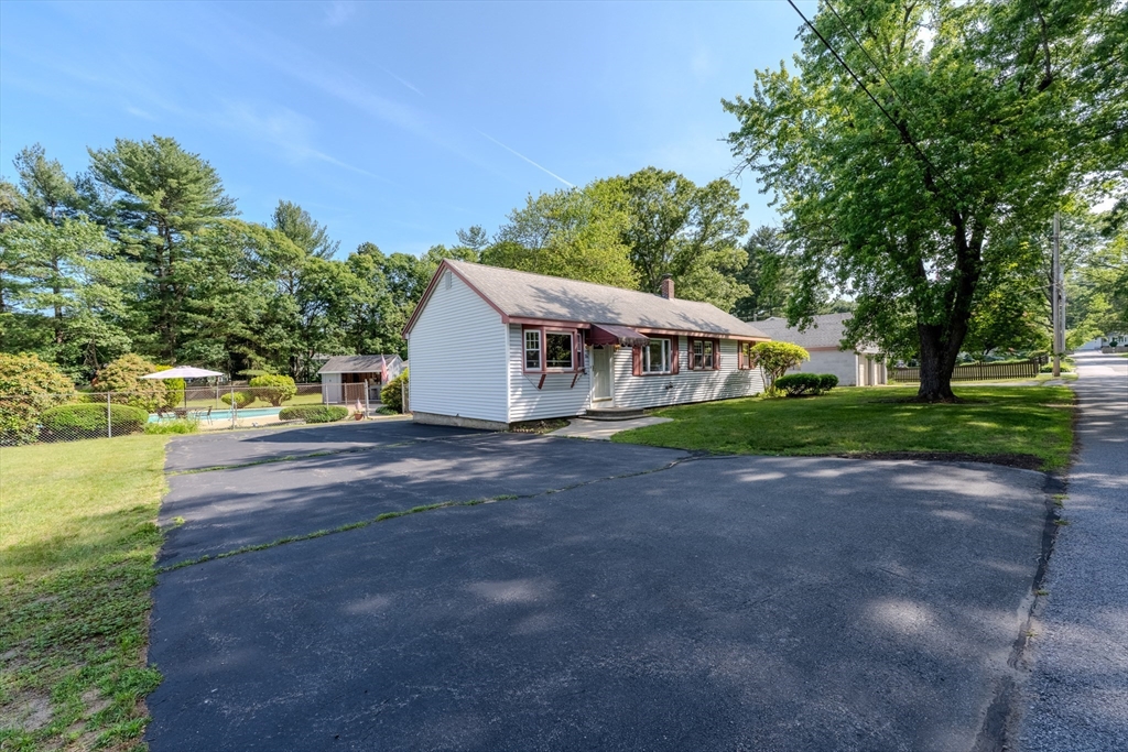 10 Primrose Road Billerica, MA 01821 - Photo 3 of 37 a view of a house with backyard and a tree