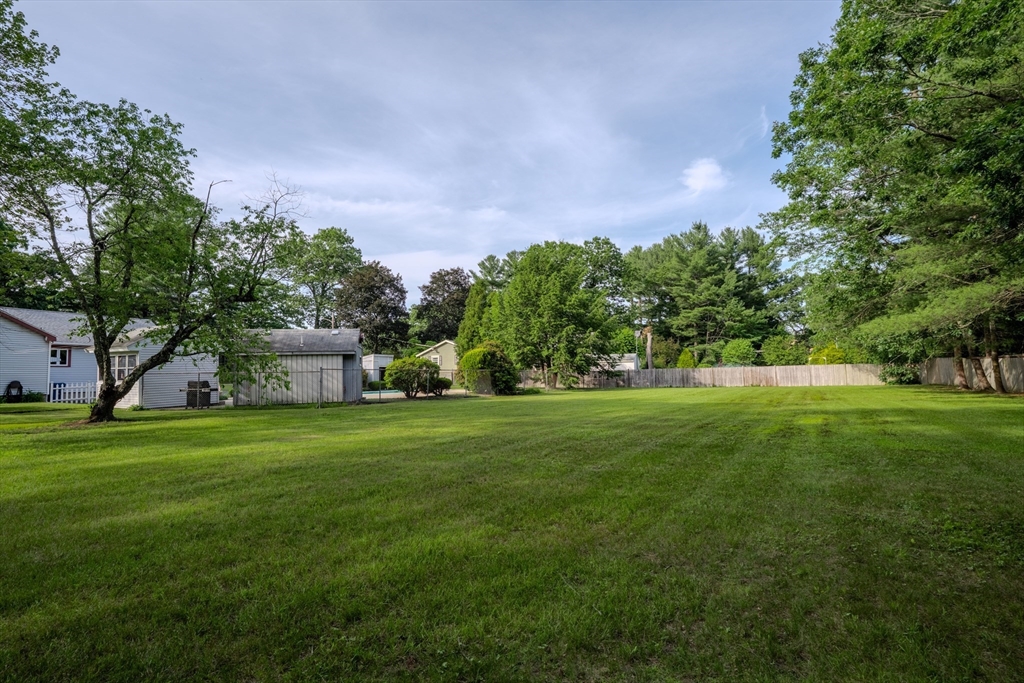 10 Primrose Road Billerica, MA 01821 - Photo 31 of 37 a view of a house with a yard