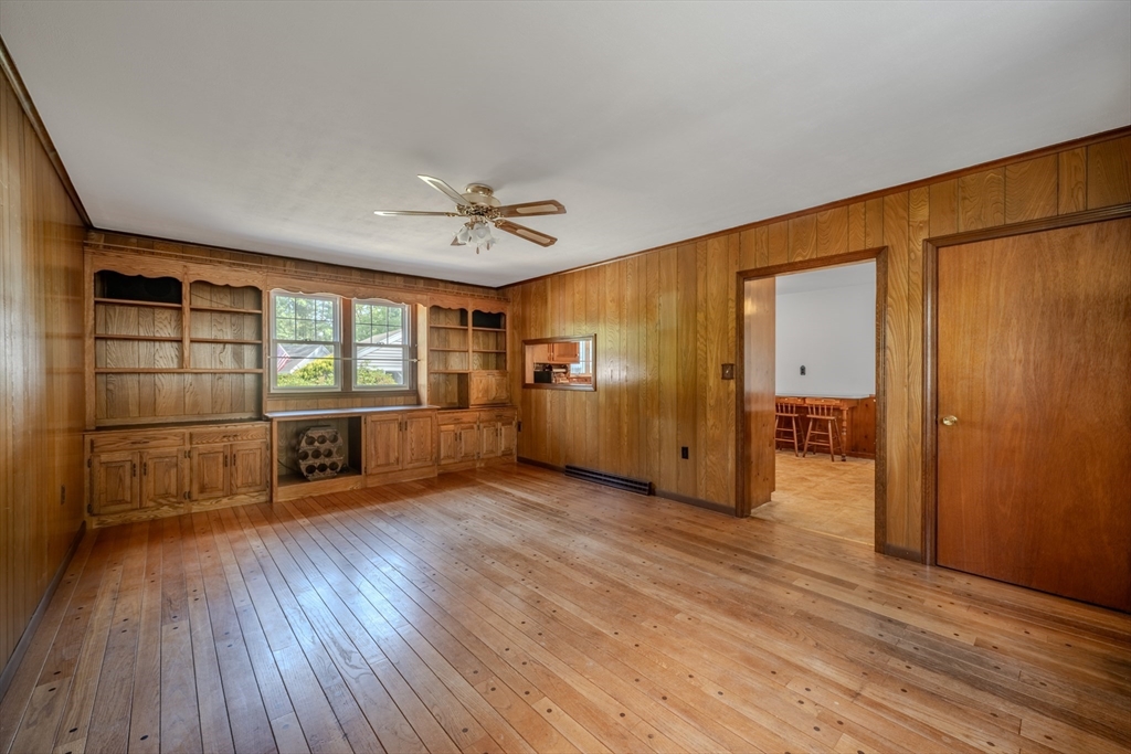 10 Primrose Road Billerica, MA 01821 - Photo 10 of 37 a view of an empty room with a window and wooden floor