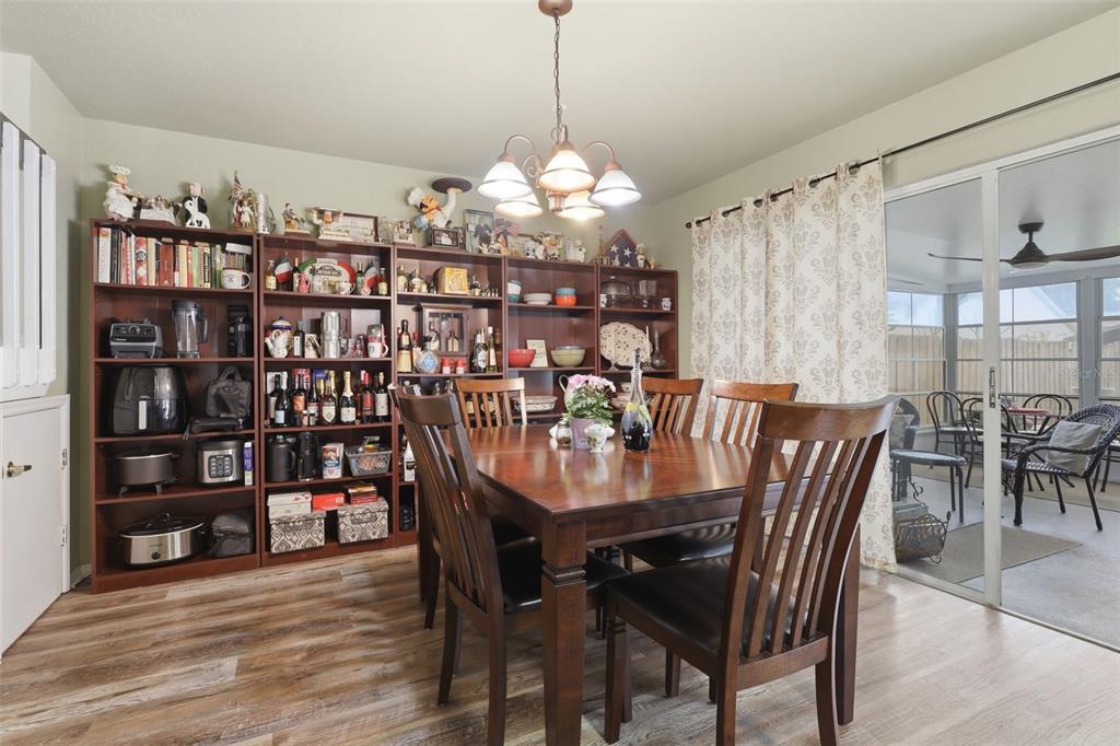 3440 Allston Lane Winter Park, FL 32792 - Photo 11 of 37 a view of a dining room with furniture and a chandelier