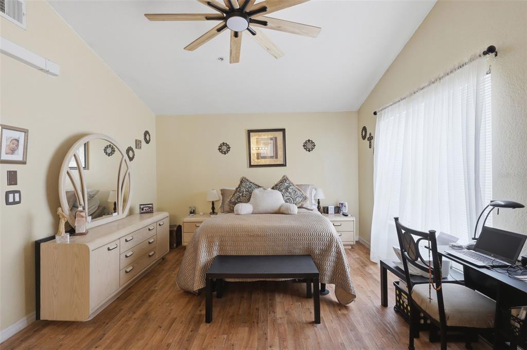3440 Allston Lane Winter Park, FL 32792 - Photo 15 of 37 a bedroom with a bed and wooden floor