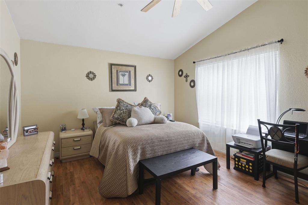 3440 Allston Lane Winter Park, FL 32792 - Photo 17 of 37 a bedroom with a bed and wooden floor