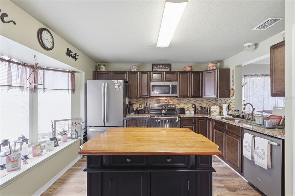 3440 Allston Lane Winter Park, FL 32792 - Photo 9 of 37 a kitchen with a stove a refrigerator and a sink
