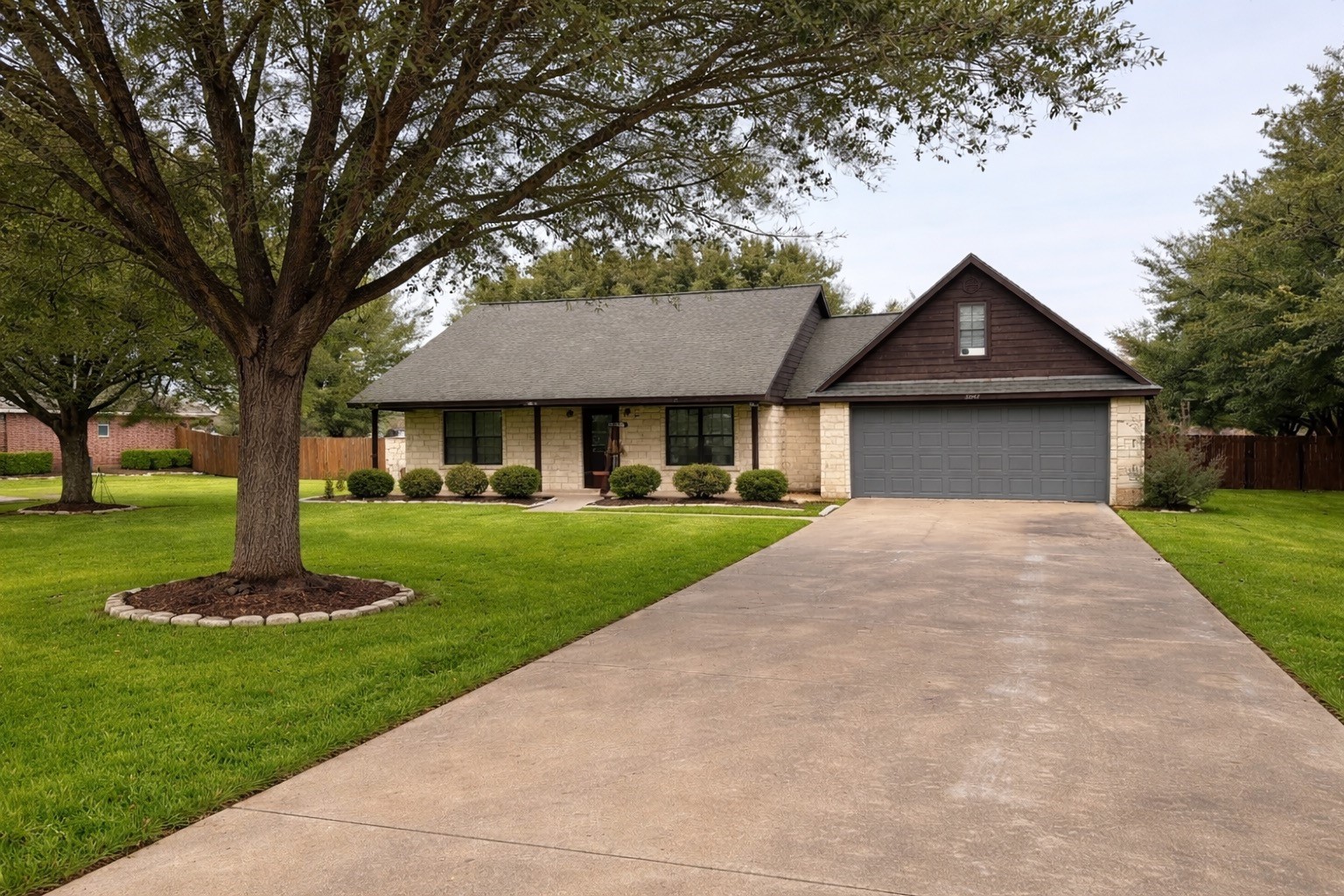 3597 Open Range Court Bryan, TX 77808 - Photo 1 of 8 a front view of a house with a yard