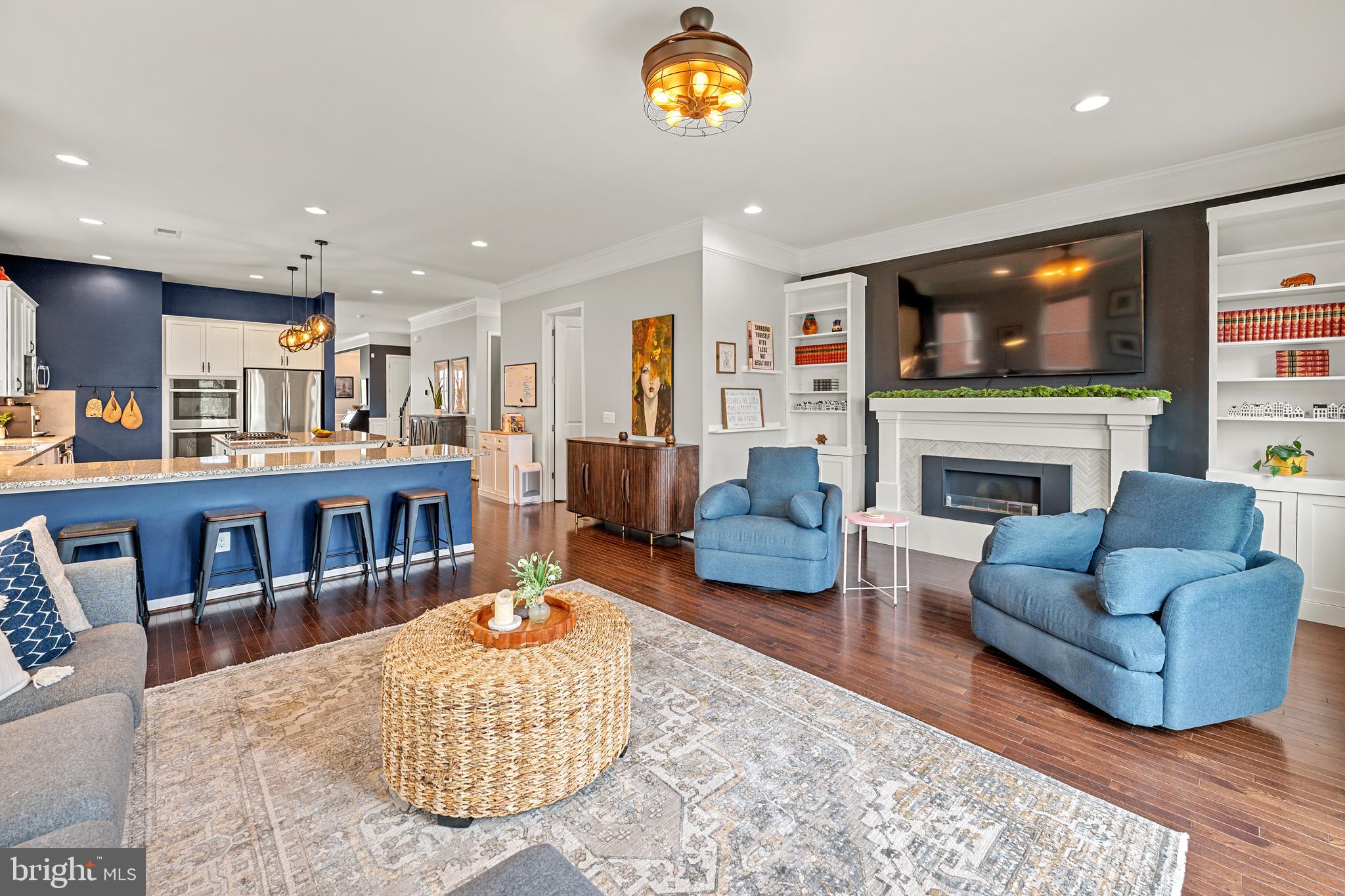 8459 Reformatory Way Lorton, VA 22079 - Photo 23 of 78 a living room with fireplace furniture and a flat screen tv