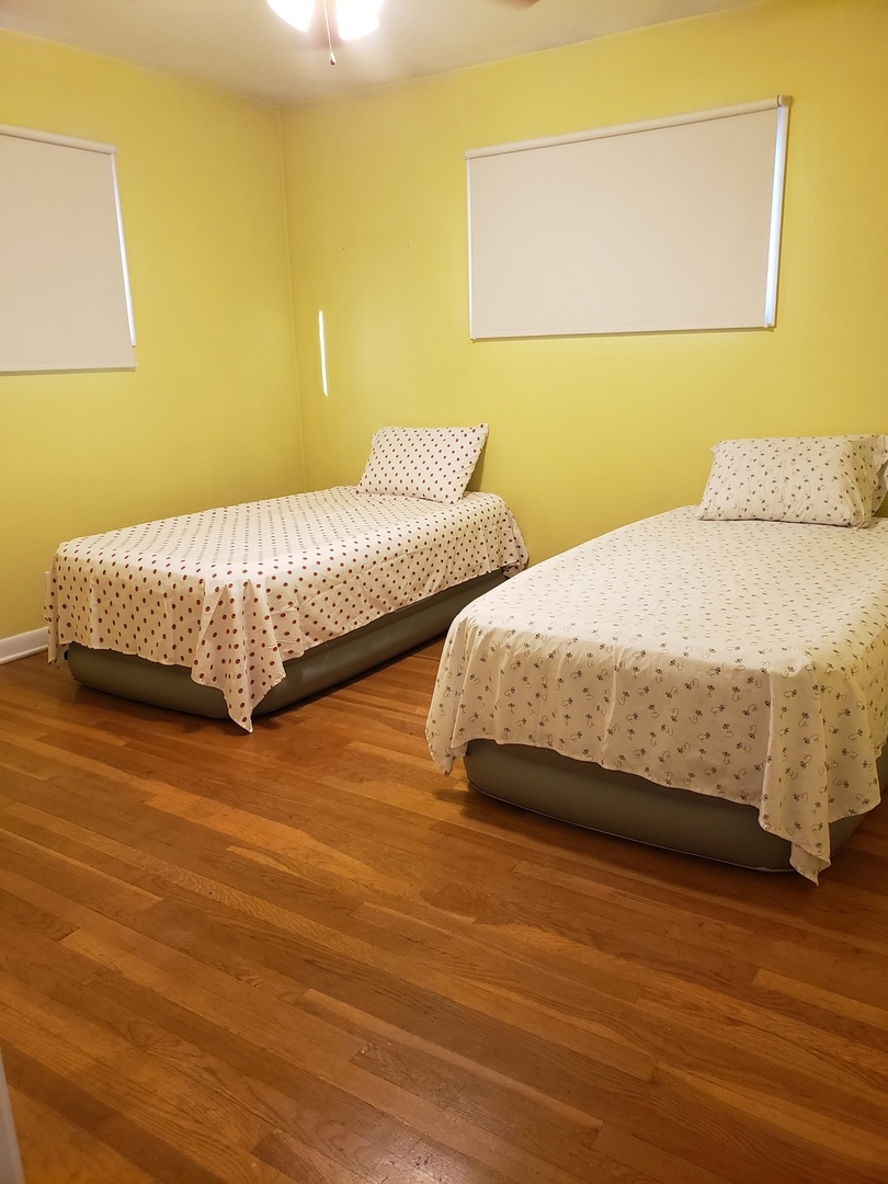 15230 Ridgeway Avenue Midlothian, IL 60445 - Photo 13 of 21 a bedroom with a bed and a night stand