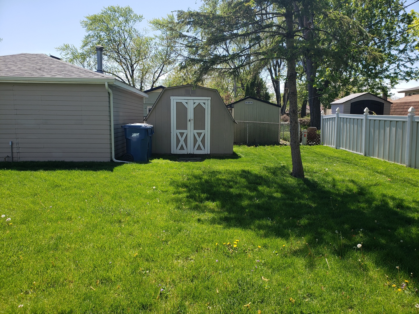 15230 Ridgeway Avenue Midlothian, IL 60445 - Photo 17 of 21 a view of a backyard with a garden