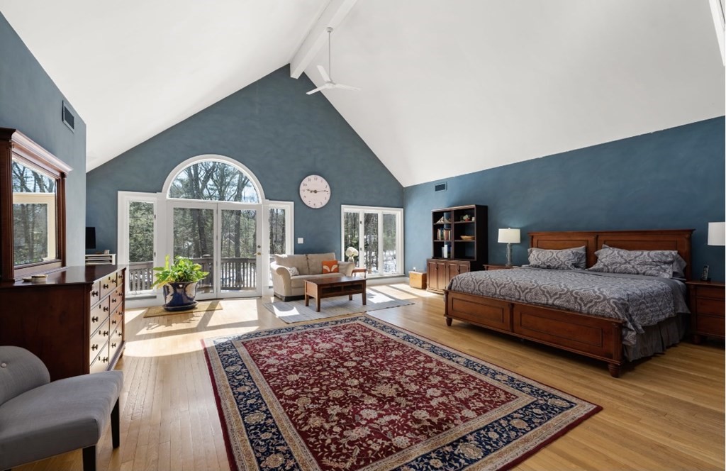 30 3 Ponds Road Wayland, MA 01778 - Photo 16 of 28 a living room with furniture a rug and a large window