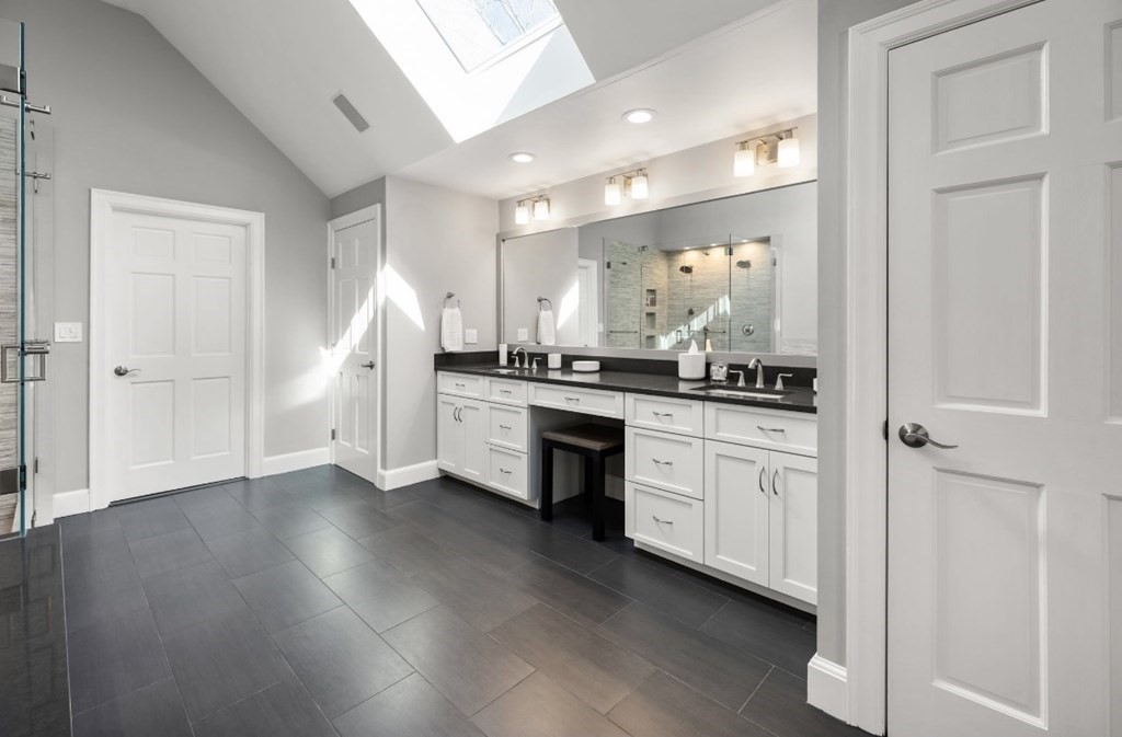 30 3 Ponds Road Wayland, MA 01778 - Photo 20 of 28 a kitchen with stainless steel appliances a refrigerator and cabinets