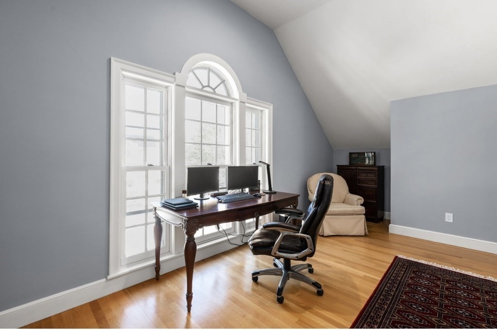 30 3 Ponds Road Wayland, MA 01778 - Photo 21 of 28 a view of a workspace with furniture and a window
