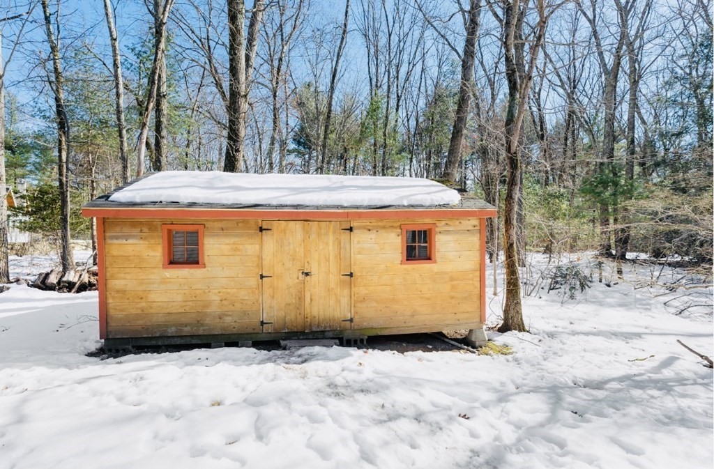 30 3 Ponds Road Wayland, MA 01778 - Photo 25 of 28 a view of a house with backyard space and trees