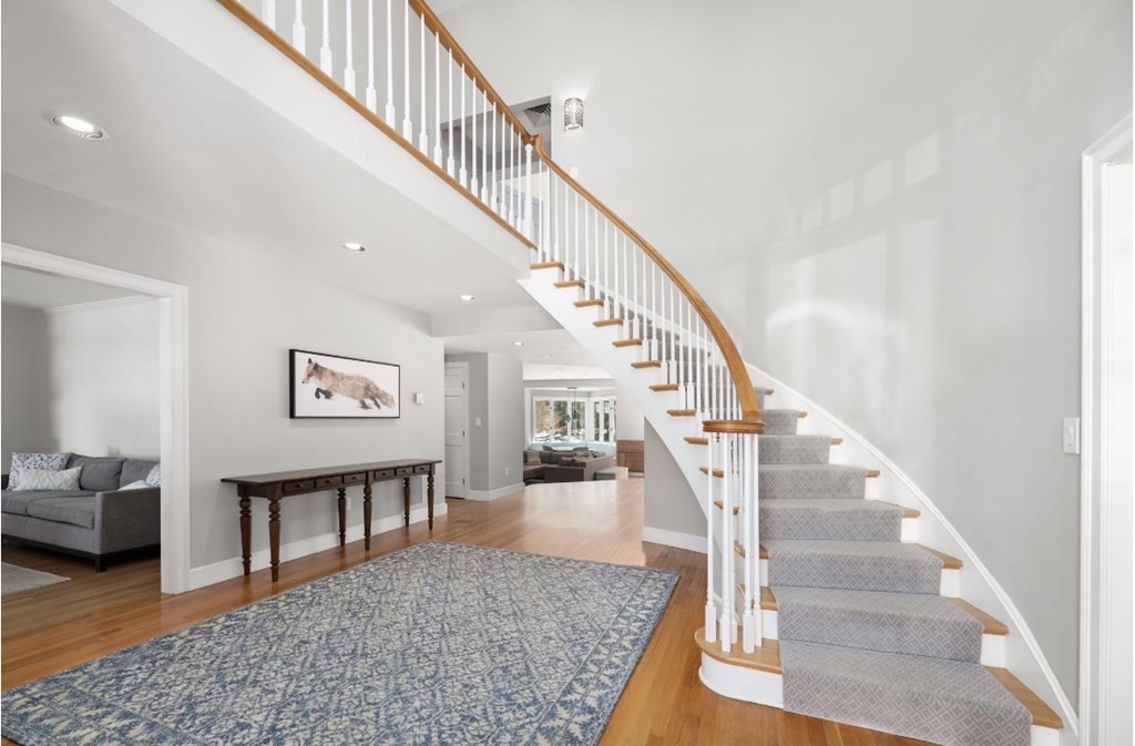 30 3 Ponds Road Wayland, MA 01778 - Photo 3 of 28 a view of entryway and hall with wooden floor