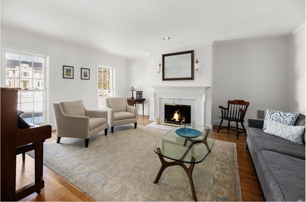 30 3 Ponds Road Wayland, MA 01778 - Photo 5 of 28 a living room with furniture and a fireplace