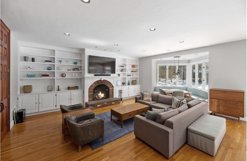 30 3 Ponds Road Wayland, MA 01778 - Photo 6 of 28 a living room with furniture and a fireplace