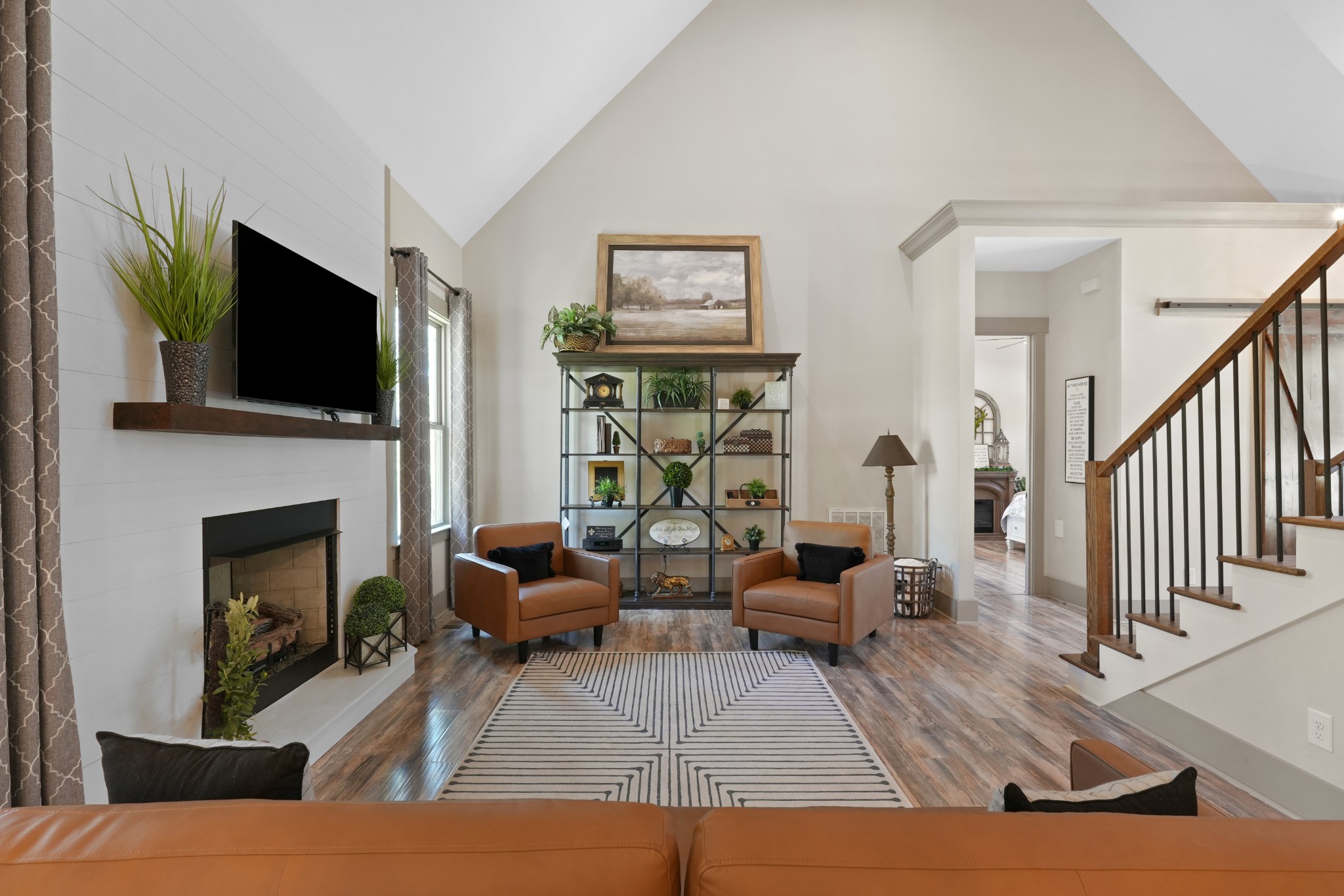 8417 Pine Ridge Road Ooltewah, TN 37363 - Photo 14 of 28 a living room with fireplace furniture and a flat screen tv