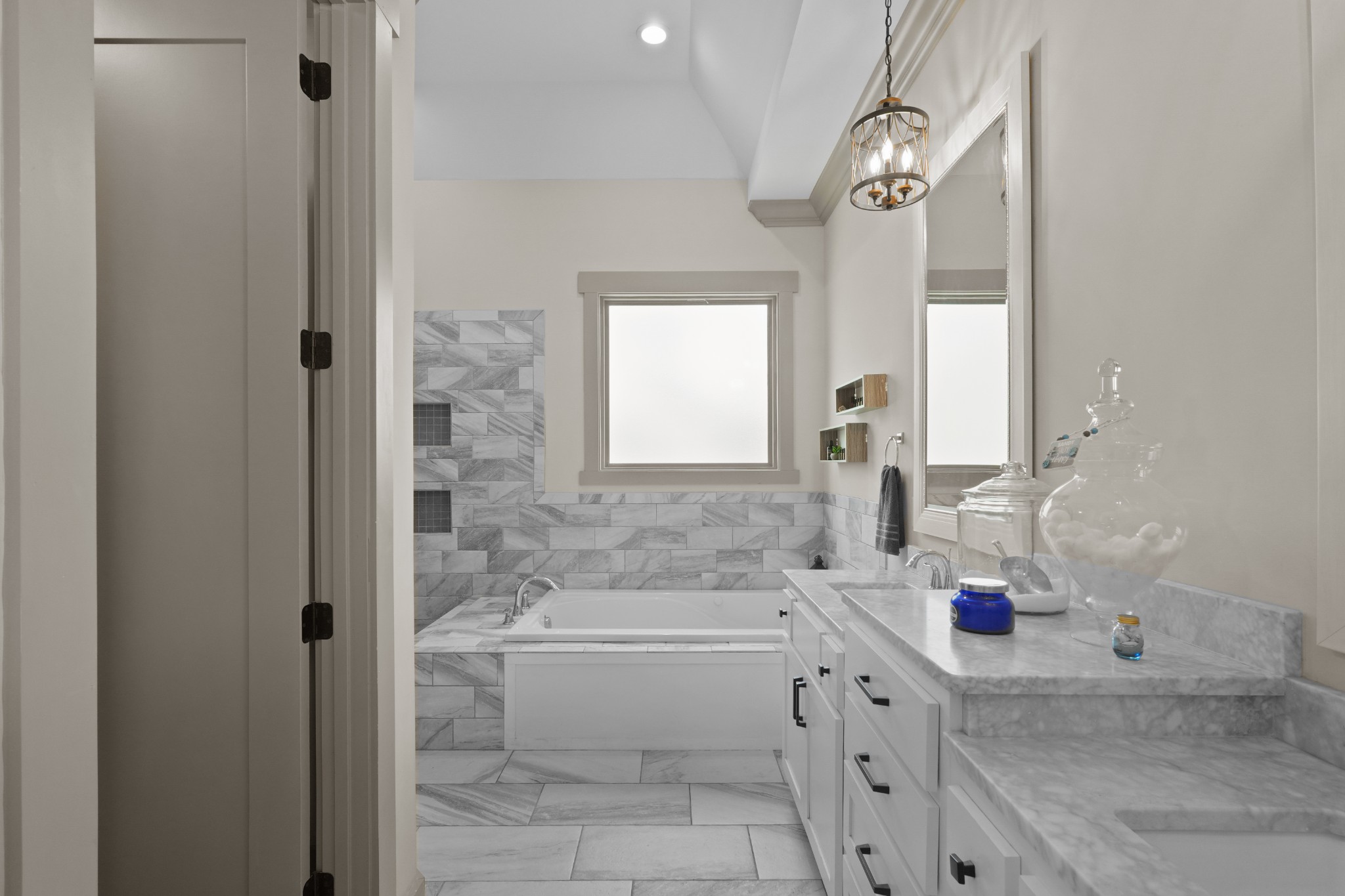8417 Pine Ridge Road Ooltewah, TN 37363 - Photo 18 of 28 a bathroom with a tub sink and mirror