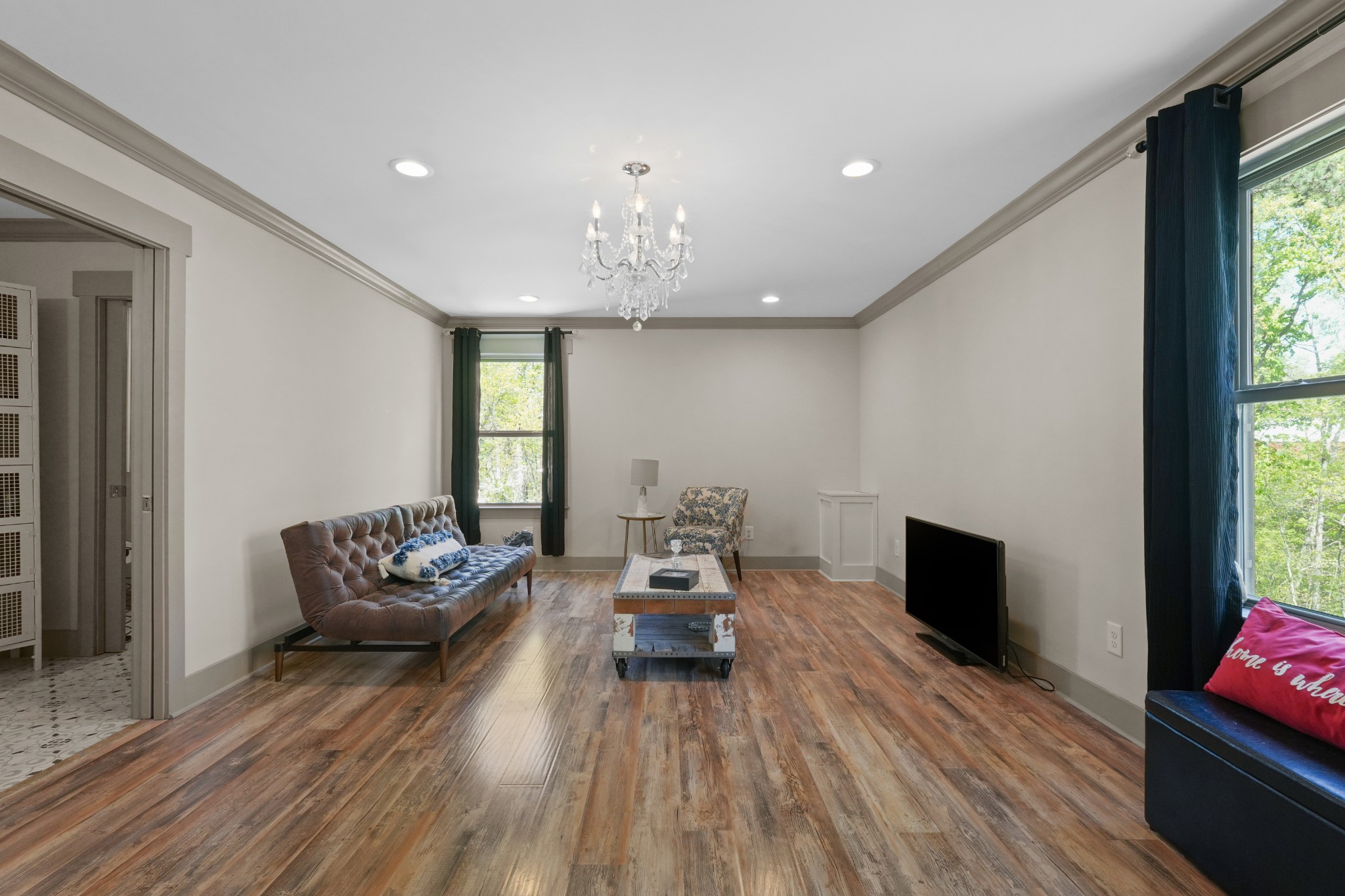 8417 Pine Ridge Road Ooltewah, TN 37363 - Photo 20 of 28 a living room with furniture and a flat screen tv
