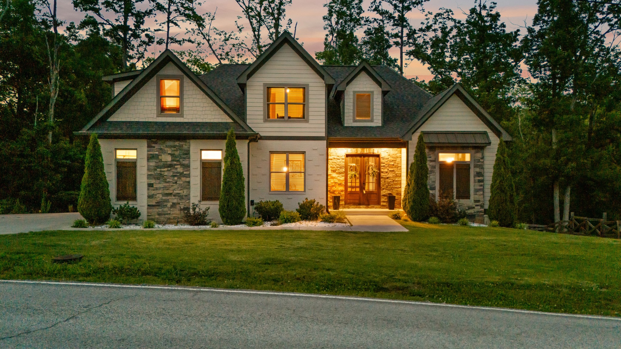 8417 Pine Ridge Road Ooltewah, TN 37363 - Photo 2 of 28 a front view of a house with a yard