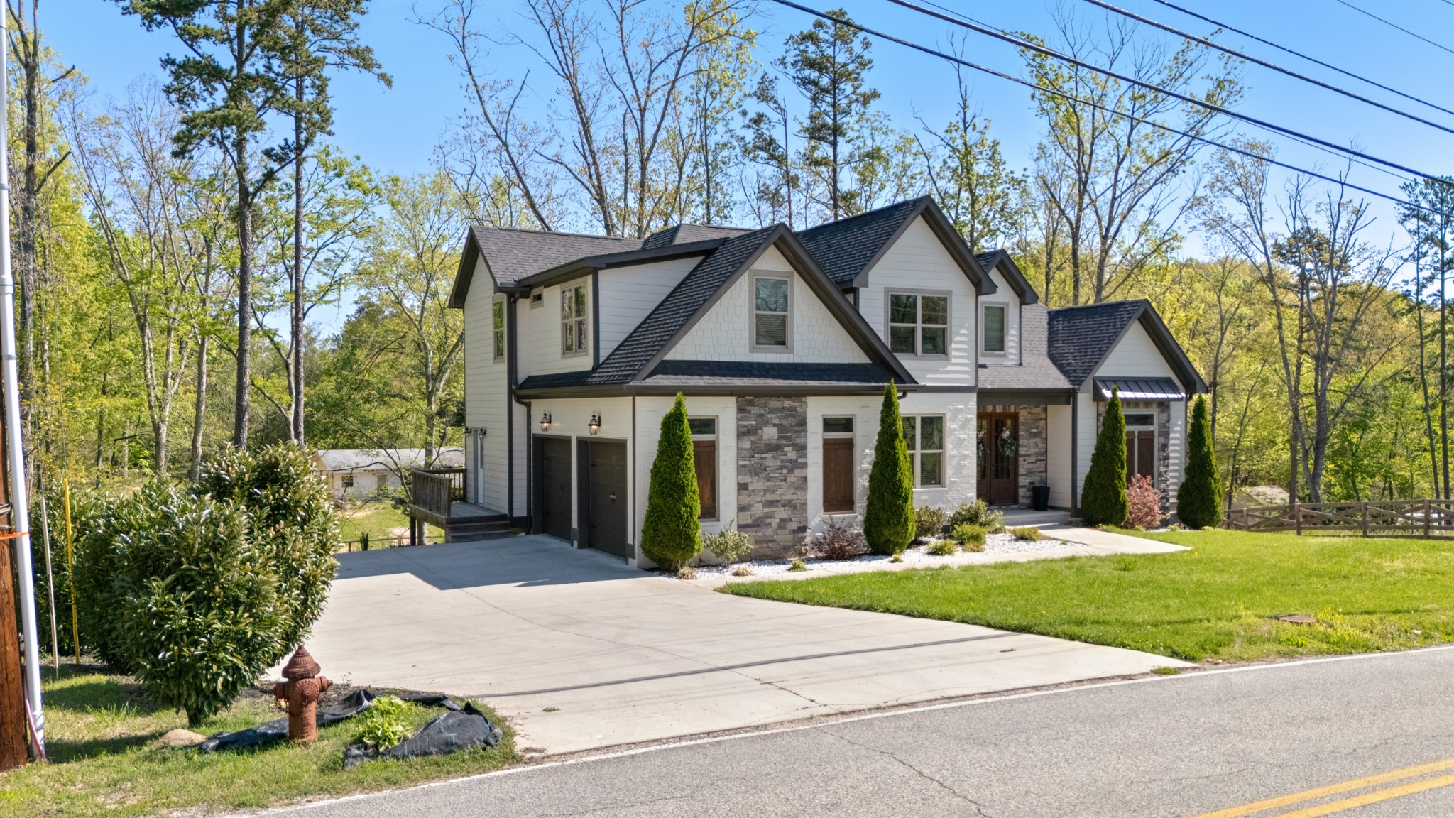 8417 Pine Ridge Road Ooltewah, TN 37363 - Photo 26 of 28 a front view of a house with a yard