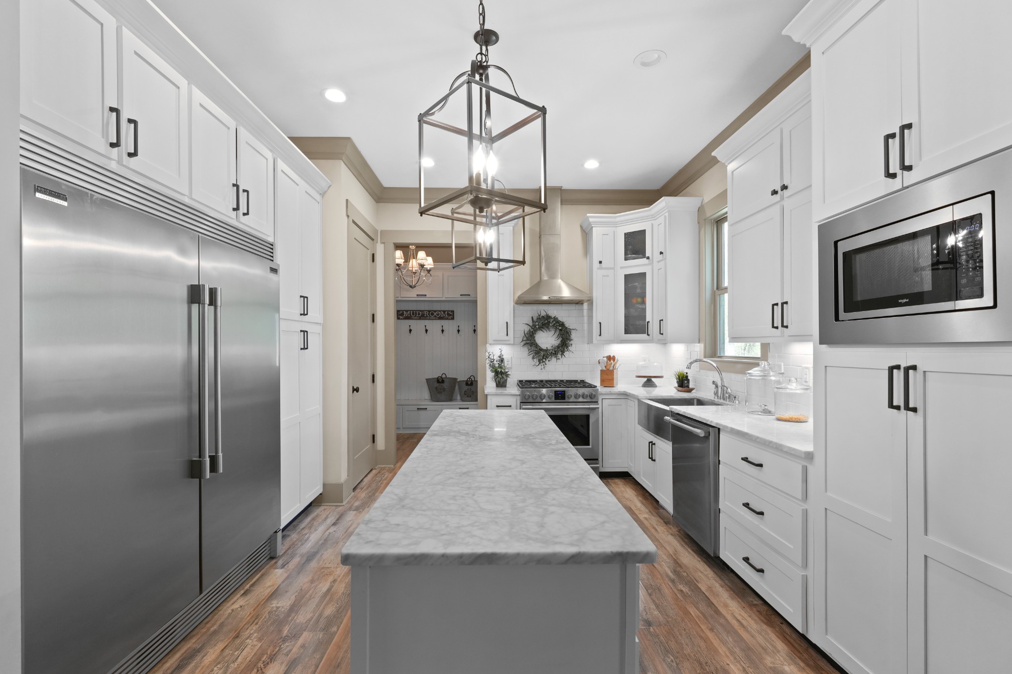 8417 Pine Ridge Road Ooltewah, TN 37363 - Photo 7 of 28 a kitchen with stainless steel appliances granite countertop a refrigerator a stove and a sink