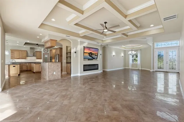 a kitchen with stainless steel appliances granite countertop a refrigerator and a stove top oven